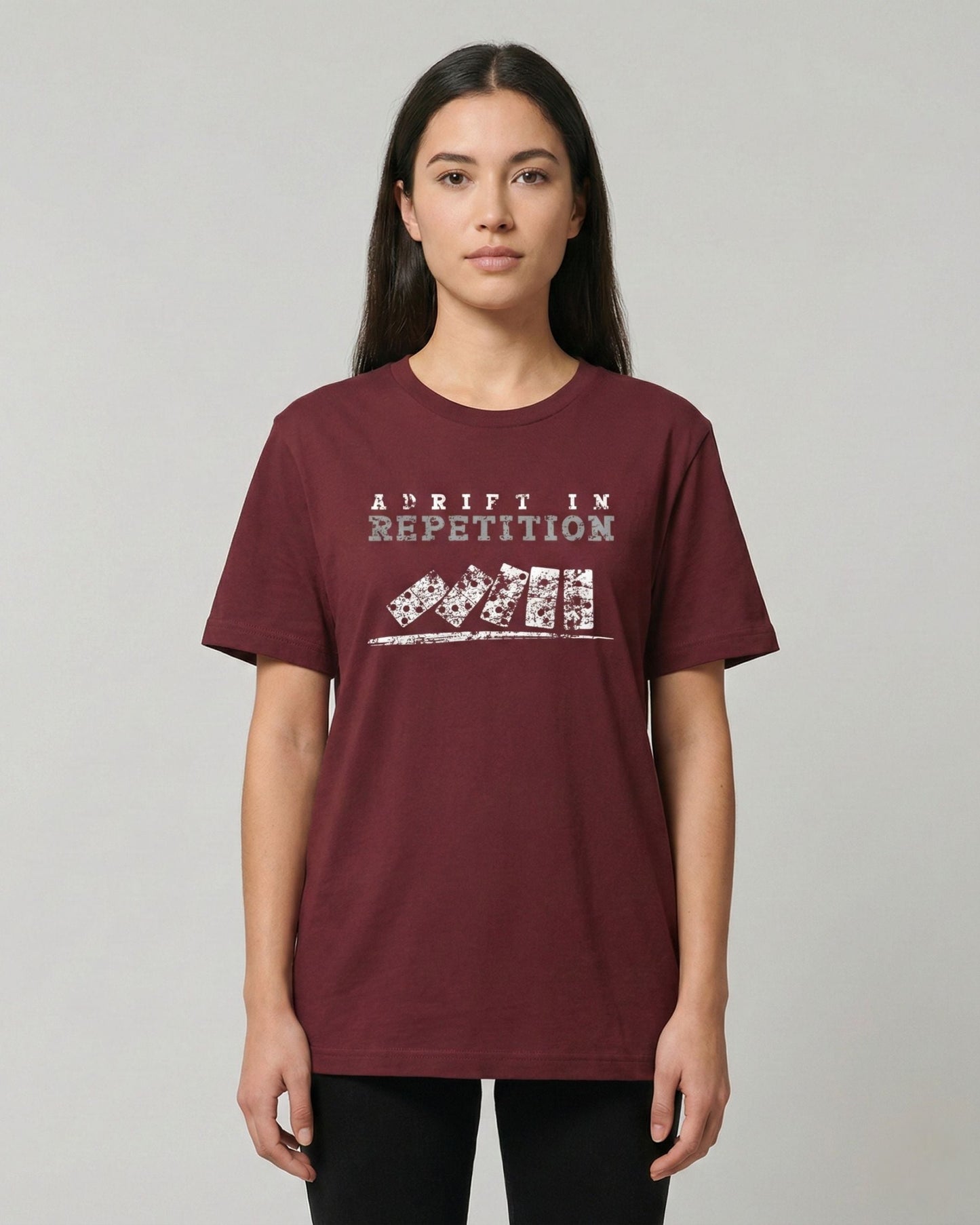 Adrift in Repetition burgundy t-shirt lifestyle photo woman wearing falling dominoes with skull faces design – UnseenYou