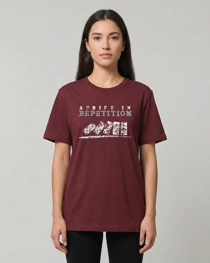 Adrift in Repetition burgundy t-shirt lifestyle photo woman wearing falling dominoes with skull faces design – UnseenYou