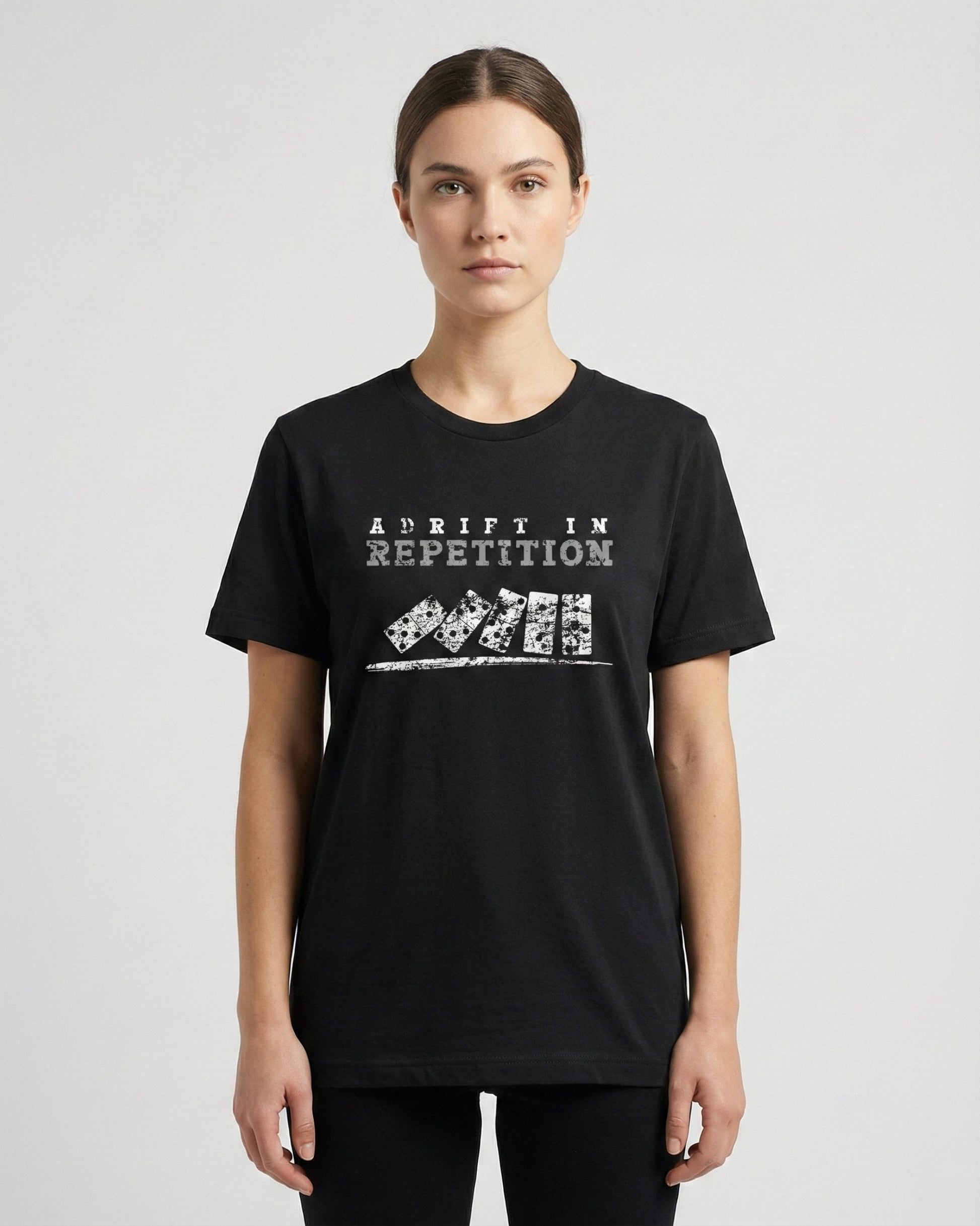 Adrift in Repetition black t-shirt lifestyle photo woman wearing falling dominoes with skull faces design – UnseenYou