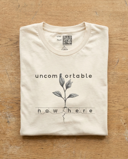 Uncomfortable Nowhere natural t-shirt flat lay – plant sprout sketch with cracked ground design – UnseenYou